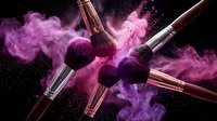 Professional makeup brushes with pink powder explosion on black background for cosmetic advertising and beauty product promotion campaigns.