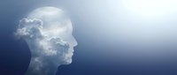 Human head silhouette filled with clouds against blue sky background representing dreams, imagination, consciousness and mental clarity concepts.