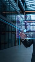 Businessman in dark suit interacting with holographic display showing ethics, compliance, and regulatory pathway icons in modern office building. Legal and governance concept.