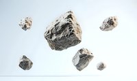 Floating gray stones or meteorites suspended in white space, showing natural rough texture and irregular shapes against clean background for scientific or design projects.