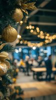 Elegant Christmas tree with gold ornaments and ribbons in foreground, blurred restaurant setting with warm string lights in background.