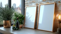 Empty wooden frames on windowsill with potted olive tree, vintage lamp and wine bottle against exposed brick wall in modern urban apartment interior.