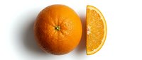 Fresh whole orange with a juicy slice on white background, isolated for food, health, and nutrition design projects.