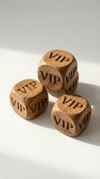Wooden dice with VIP text engraved on all sides for luxury gaming, premium entertainment and exclusive membership concepts on white background.