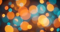 Abstract bokeh lights background with warm orange and cool teal blue circles creating dreamy atmosphere for web design and digital projects.