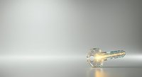 Transparent glass key with golden light glow isolated on white background, ready for design use on merchandise, web graphics, and promotional materials.
