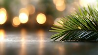 Fresh green palm leaf branch against blurred warm bokeh lights creating magical holiday atmosphere, selective focus on natural foliage detail.