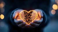 Glowing heart shape made of golden lights held gently in cupped hands against dark background with bokeh effect, symbolizing love, hope and magic.