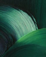 Abstract emerald green brushstroke waves create dynamic flowing curves and textures against dark background, showcasing artistic movement and depth in modern style.