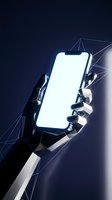 Futuristic robotic hand holding smartphone with blank white screen against dark blue background with geometric light effects for technology concepts.