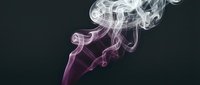 Wispy smoke trails in white and purple hues swirling against dark background, suitable for overlays, motion graphics, and visual effects projects.