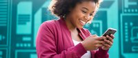 Happy African American businesswoman using smartphone in modern office with server room background for corporate communication and technology solutions.