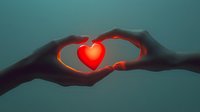 Silhouetted hands forming heart shape with glowing red heart floating between them against dark teal background, symbolizing love, care and connection.
