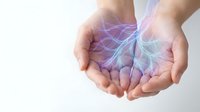 Cupped hands holding glowing digital neural network with purple and blue light effects representing artificial intelligence and technology innovation.