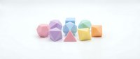 Colorful geometric shapes including cubes, pyramids, and polyhedrons in pastel pink, purple, blue, yellow, and orange isolated on white background for design projects.
