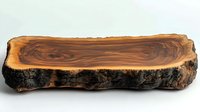 Natural walnut wood slab with raw bark edge showing distinctive grain pattern and organic shape on white background, ready for furniture design projects.