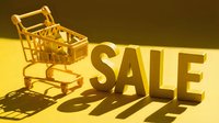 Golden shopping cart beside bold SALE letters casting dramatic shadows on yellow background, evoking retail discount and seasonal promotion concepts.