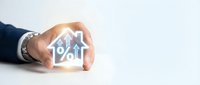 Businessman hands protecting house icon with percentage symbol and upward arrow representing mortgage rates, real estate investment growth concept.