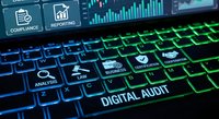 Digital audit concept with glowing keyboard and financial data visualization on computer screen for business compliance and reporting analysis.