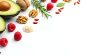 Healthy organic food ingredients with avocado, nuts, berries and herbs on white background with copy space for nutrition and wellness concepts.