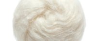 Soft white wool fibers twisted into a fluffy, textured ball for crafting, textile design, and natural material backgrounds.