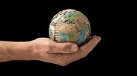 Caucasian male hand holding a textured globe with continents and ocean details on transparent background. Ready for environmental, sustainability, and business design projects including t-shirts, posters, and print-on-demand products.