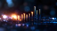 Glowing metallic pillars rising at night with illuminated golden and blue lights creating futuristic cityscape atmosphere against dark background with bokeh effect.