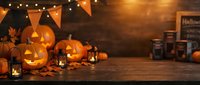 Halloween pumpkins with glowing candles and autumn decorations on rustic wooden table with warm lighting and festive bunting for seasonal celebrations.