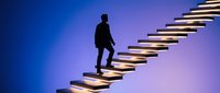 Silhouette of male professional climbing illuminated staircase against blue and purple gradient background, representing career growth, success, and business advancement.