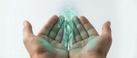 Cupped hands holding glowing green energy figure representing healing, spirituality, wellness and alternative medicine practices for holistic health concepts.