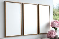Three wooden frame mockups on white wall with pink peonies. Minimal interior design template for artwork, paintings, photographs or posters presentation.