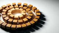 Wooden blocks arranged in concentric circles creating geometric spiral pattern on white surface with dramatic shadows for design projects.