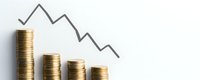 Declining stacks of gold coins with downward trending graph line on white background, representing financial loss, market crash, and economic recession.