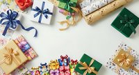 Colorful wrapped gift boxes with ribbons and bows arranged on white background for holiday celebrations, festive occasions, and seasonal greeting card designs.