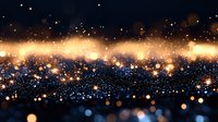 Magical glowing particles and bokeh lights on dark background create dreamy atmosphere with golden sparkles and blue dots floating in space. Festive backdrop.
