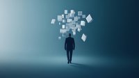 Silhouette of businessman walking while digital paper documents float above head against blue gradient background, representing information overload.