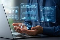 Business professional analyzing digital marketing data with holographic interface displaying web analytics charts and statistical reports above hands.