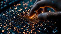 Robotic hand touching digital circuit board with glowing orange particles and bokeh lights creating futuristic technological connection visualization.
