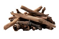 Dried licorice root pieces in natural brown color isolated on white background, aromatic herbal medicine and culinary spice ingredient for cooking and wellness.