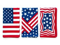 Patriotic red, white and blue fabric bundles featuring stars and stripes patterns. Set of three folded textiles with traditional flag designs for holiday crafts, sewing projects and decorative applications.
