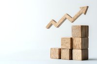 Wooden blocks stacked in ascending order with upward trending arrow above, representing business growth and success on white background.