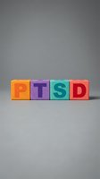 PTSD acronym spelled with colorful wooden blocks in orange, purple, teal, and red on neutral background for mental health awareness and psychology education.