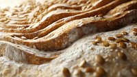 Fresh baked artisan bread loaves with golden crust and seeds, rustic bakery display perfect for food photography and culinary marketing materials.