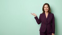 Professional businesswoman in burgundy suit presenting with open palm gesture against mint green background for corporate marketing materials.