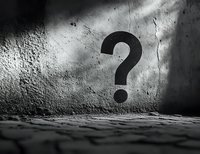 Black question mark shadow on rough concrete wall in dramatic lighting, creating mysterious atmosphere and uncertainty concept for business presentations.
