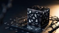 Black Halloween gift box with spooky white icons including ghosts, bats, pumpkins and skulls, decorated with golden ribbon on dark atmospheric background.