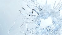 Frozen ice crystals macro photography with detailed structure and patterns in light blue and white tones creating abstract winter background.