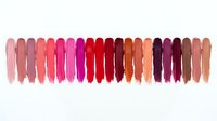 Colorful lipstick swatches palette showing various shades from nude to deep red and burgundy tones for cosmetic beauty makeup collection.