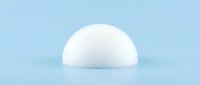 White hemisphere sphere on light blue background with soft shadows for modern minimalist design and product presentation.