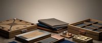 Luxury wooden storage boxes and organizers with geometric patterns and compartments for jewelry, accessories, and small items organization.